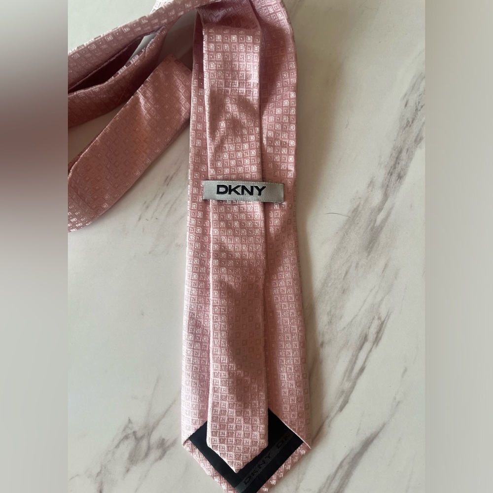 Pink DKNY tie.